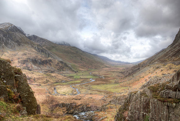 Nant Ffrancon Valley, Snowdonia - North Wales. A view looking right down the valley on an overcast day with the sky full of clouds. Smart Imaging & Framing Landscape Photography