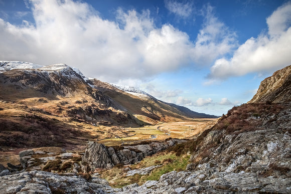Nant Ffrancon Valley, Spring in Snowdonia - cloudy blue skies above and a sunkissed valley below. A fantastic Snowdonia countryside scene at Ogwen Valley
