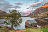 Last light at Llyn Ogwen - As the sun sets, a soft warm light falls across the landscape at Llyn Ogwen in Snowdonia, North Wales. Highlighting the top of Tryfan and the clouds beyond