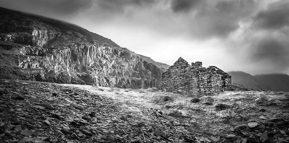 B&W The Quarry Face - Dinorwic Quarry - A stormy day in Snowdonia National Park with the grey sky above imitating the slate colour below