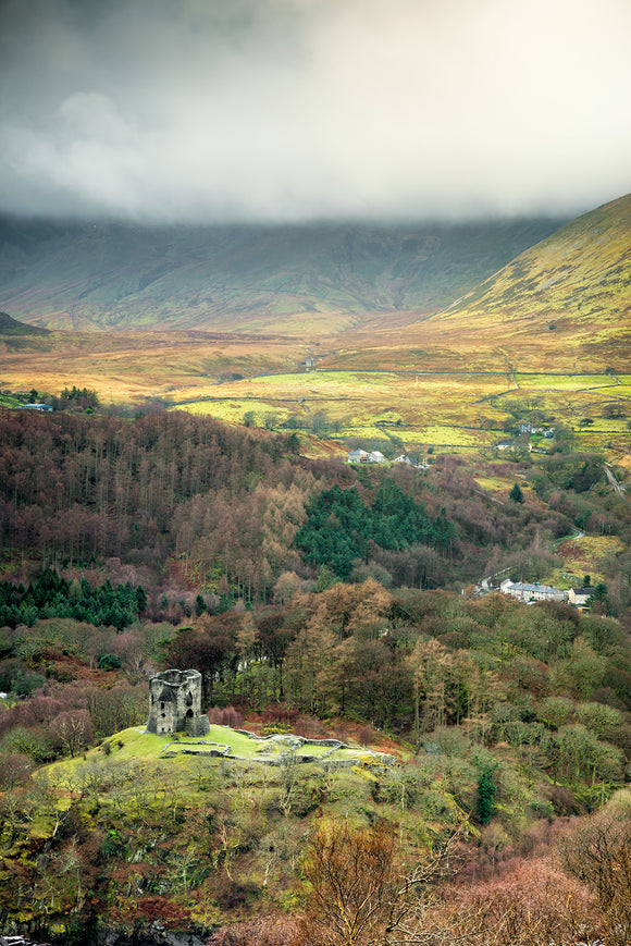 Dolbadarn Castle - A View from Above. An aerial view from above Llanberis looking down onto Dolbadarn Castle and the surrounding trees and landscape of Snowdonia National Park. ©Smart Imaging, North Wales